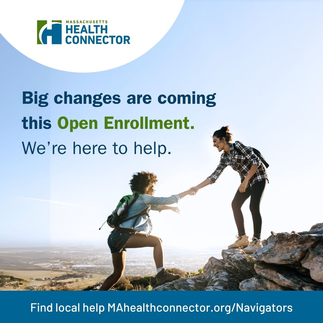 Two people hiking on a cliff edge.